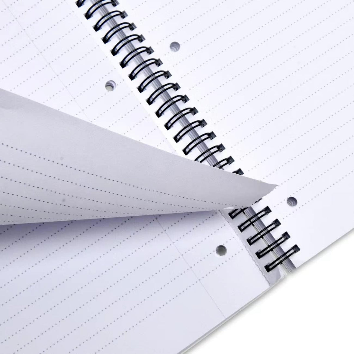 Close-up of a spiral-bound Ophaya notebook with lined dot-code pages